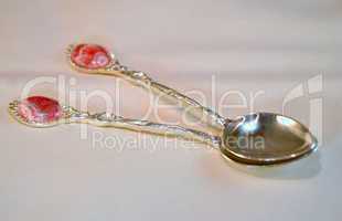 Ornate silver spoons with  pink rhodochrosite stone