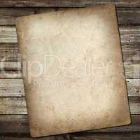 old vintage card on grungy wooden background