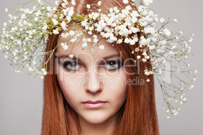 Portrait of girl with wreath of flowers