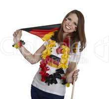 attractive woman shows german flag and smiles in front of white background