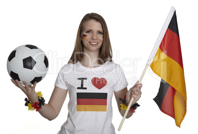 attractive woman shows german flag and football and smiles in front of white background