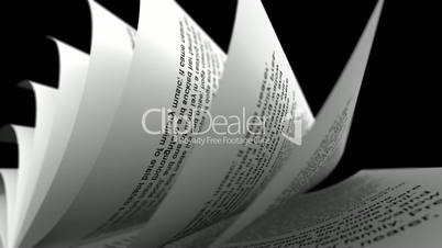 Close-up of rolled paper sheets on black background. Loopable.