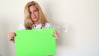 Sad Woman Holding Onto A Green Screen