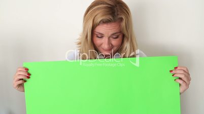 Woman Holding Onto A Green Screen