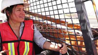 Industrial Female On Skid-steer Smile