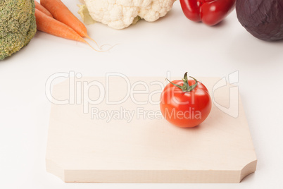 tomato on cutting board