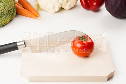 tomato on cutting board