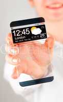 Smartphone with transparent screen in human hands.