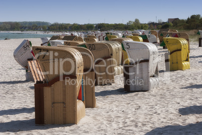 hooded beach chairs at summer beach