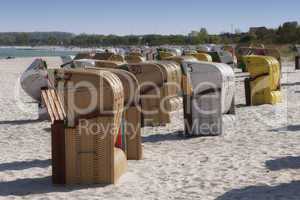 hooded beach chairs at summer beach