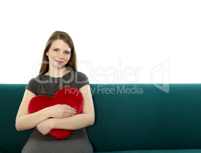 beautyful young woman with heart shaped pillow