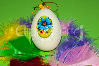 Easter egg and bird feathers.