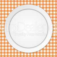 white plate on orange tablecloth