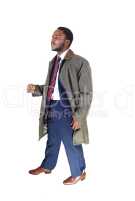 man in coat walking.