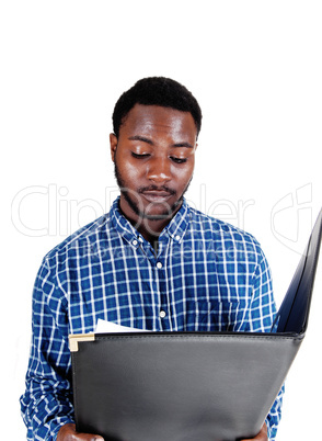 black man reading paper.