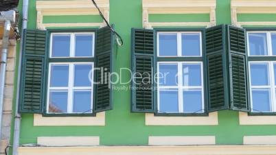 Green Windows with Shutters