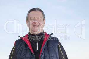 portrait of a gray-haired man while walking