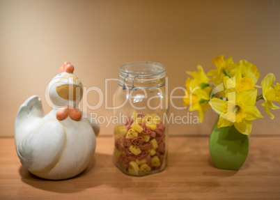 Chicken ornament, pasta and daffodils
