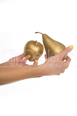 Woman holding a gold apple and pear