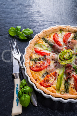 green asparagi tart with eggs and tomato