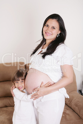 portrait of pregnant woman with her daughter