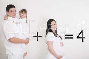 happy family: pregnant mother with father and little girl