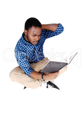 black man sitting on floor.