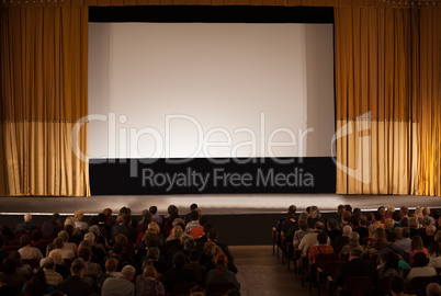 audience in front of white cinema screen