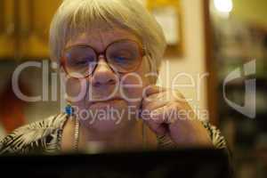 modern elderly woman using skype