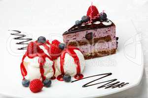 vanilla ice cream with berries and cake