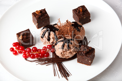 chocolate ice cream with bonbons and red currants