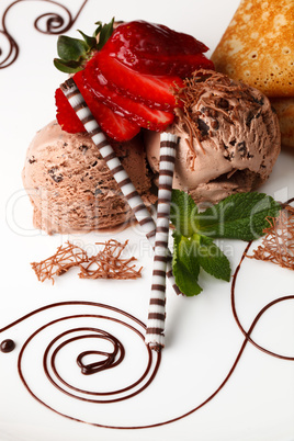 chocolate ice cream topped with fresh strawberries