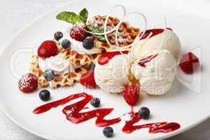 vanilla ice cream and waffles with fresh berries