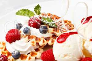 waffle with vanilla ice cream and fresh berries