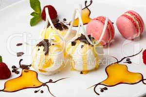 pink macaroons with vanilla ice cream and honey