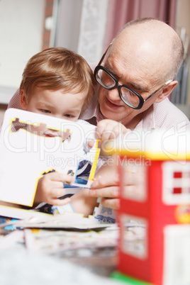 grandpa and his grandson playing