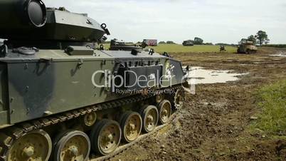 tanks in a muddy field