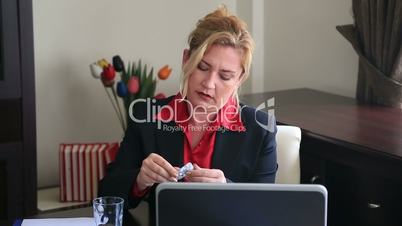 businesswoman taking pill