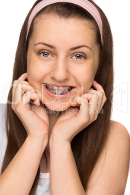 smiling girl with braces isolated