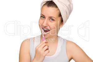 girl with braces brushing teeth isolated