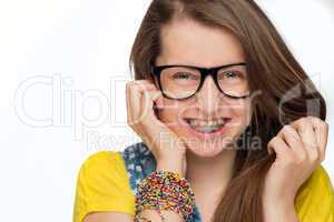 girl with braces wearing geek glasses isolated