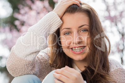 happy girl wearing braces spring portrait
