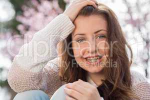 happy girl wearing braces spring portrait