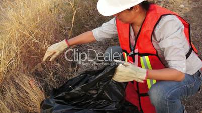 environmental woman cleaning garbage