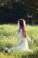 girl sitting on a meadow