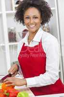 mixed race african american woman cooking kitchen