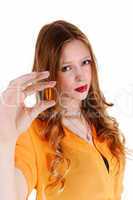 girl showing vitamin pill.