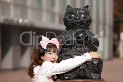 japanese girl and cat statue