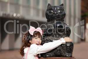 japanese girl and cat statue