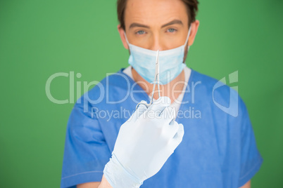 Male nurse or doctor with a pair of forceps